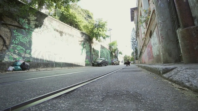 Video Reference: Road, Asphalt, Lane, Street, Thoroughfare, Infrastructure, Town, Road surface, Alley, Architecture