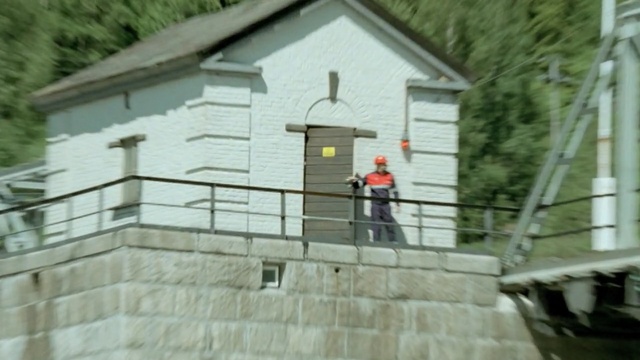 Video Reference: house, building, roof, facade, home, cottage, window, siding, Person