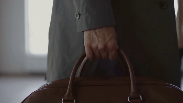 Video Reference: Bag, Brown, Handbag, Shoulder, Leather, Fashion accessory, Material property, Hand, Outerwear, Luggage and bags