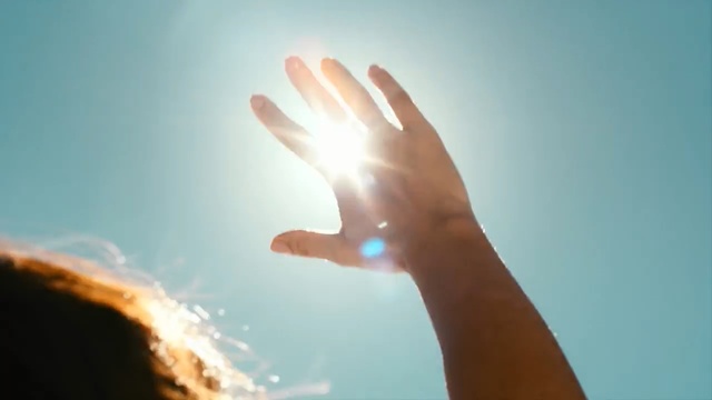 Video Reference: sky, hand, finger, daytime, light, sunlight, atmosphere, sun, morning, close up