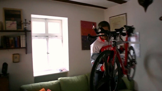 Video Reference: room, vehicle, bicycle, window, hybrid bicycle, house, sports equipment, product, Person