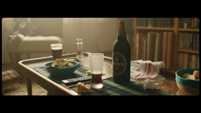 Video Reference: Product, Glass bottle, Drink, Table, Bottle, Alcohol, Photography, Room, Still life photography, Furniture, Person, Indoor, Food, Sitting, Photo, Wine, Small, Topped, Plate, Tray, Set, Glass, Counter, Different, Black, Laptop, Bowl, Woman, Holding, Man, Computer, Red, Water, Cake, White, Sandwich, Standing, Phone, Blue, Vase, Text, Beer, Tableware