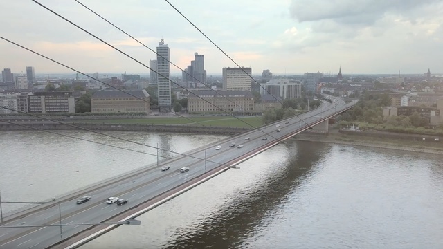 Video Reference: bridge, river, skyline, city, suspension bridge, fixed link, metropolitan area, water resources, extradosed bridge, cable stayed bridge, Person