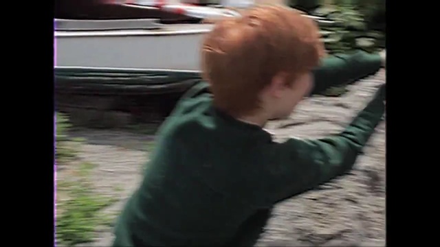 Video Reference: hair, mammal, human hair color, vertebrate, mode of transport, head, emotion, girl, sitting, mouth