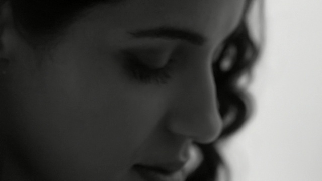 Video Reference: Face, Black, White, Nose, Hair, Lip, Eyebrow, Photograph, Facial expression, Cheek