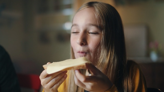 Video Reference: Junk food, Eating, Fast food, Food craving, Food, Long hair, Smile, Person