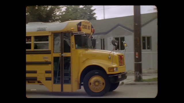 Video Reference: motor vehicle, vehicle, transport, yellow, truck, car, mode of transport, commercial vehicle, automotive exterior, public utility, Person