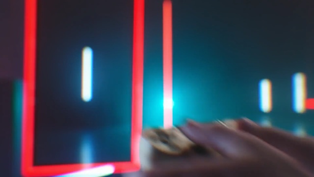 Video Reference: Light, Blue, Lighting, Finger, Material property, Hand, Technology, Electric blue, Gadget
