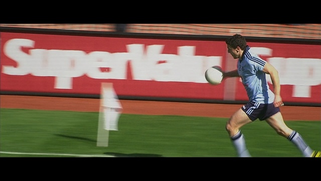 Video Reference: Player, Sport venue, Sports equipment, Ball game, Sports, Team sport, Football, Stadium, Football player, Tournament, Grass, Person, Game, Ball, Man, Field, Standing, Swinging, Throwing, Baseball, Woman, Holding, White, Playing, Blue, Red, Air, Athletic game, Sport, Sports uniform, Soccer, Tennis