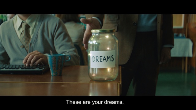 Video Reference: Glass bottle, Product, Water, Alcohol, Bottle, Drink, Glass, Liqueur, Drinkware, Table, Indoor, Sitting, Person, Laptop, Computer, Man, Front, Food, Looking, Young, Using, Woman, Screen, Black, Desk, Girl, Holding, Wooden, Large, Eating, Restaurant, People, Tableware, Text, Mug, Coffee cup, Coffee, Cup, Soft drink, Jug, Pitcher