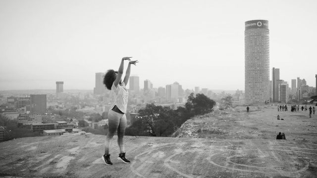 Video Reference: black and white, urban area, photography, monochrome photography, sky, city, recreation, monochrome, building, tree, Person