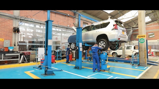 Video Reference: blue, car, automobile repair shop, motor vehicle, automotive design, vehicle, technology, factory, sport venue