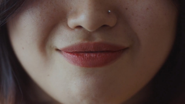 Video Reference: Face, Lip, Cheek, Nose, Skin, Chin, Facial expression, Eyebrow, Close-up, Mouth, Person, Indoor, Woman, Wearing, Glasses, Looking, Hair, Girl, Shirt, Close, Black, Young, Red, Lady, Brushing, Eating, Bite, Eyes, Teeth, Head, Blue, White, Holding, Food, Hat, Sunglasses, Human face, Lipstick, Tooth, Eyelash, Cosmetics, Jaw, Forehead, Smile, Staring