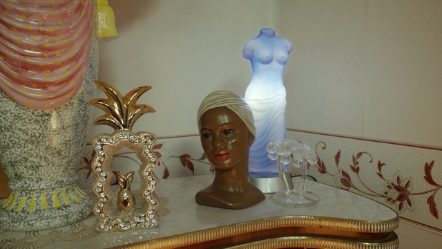 Video Reference: figurine, art, carving, sculpture, ceramic, statue, Person