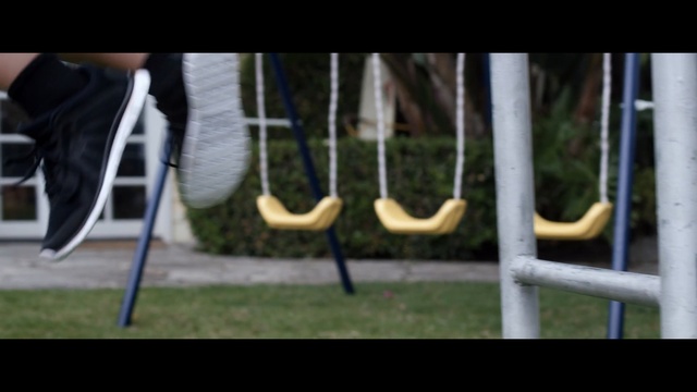 Video Reference: mammal, footwear, grass, shoe, player, tree, recreation, outdoor play equipment, swing, product