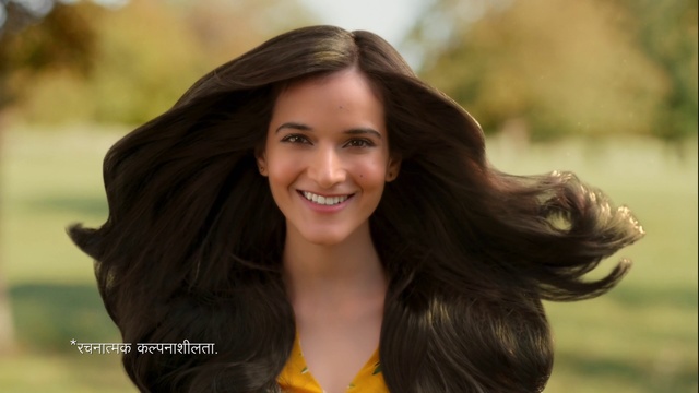 Video Reference: Hair, Face, Facial expression, Hairstyle, Smile, Long hair, Beauty, Skin, Black hair, Brown hair