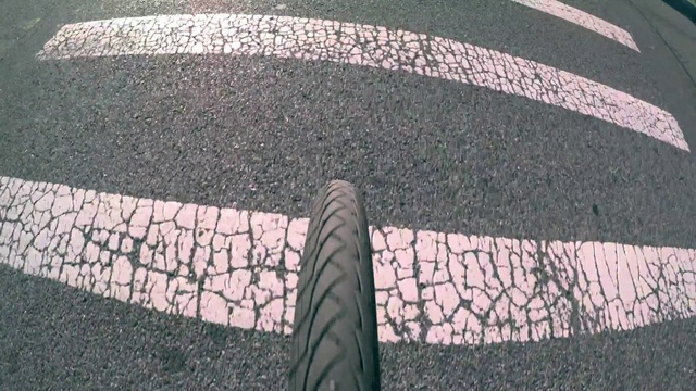 Video Reference: Tire, Automotive tire, Asphalt, Road, Road surface, Bicycle tire, Infrastructure, Grass, Automotive wheel system, Tread