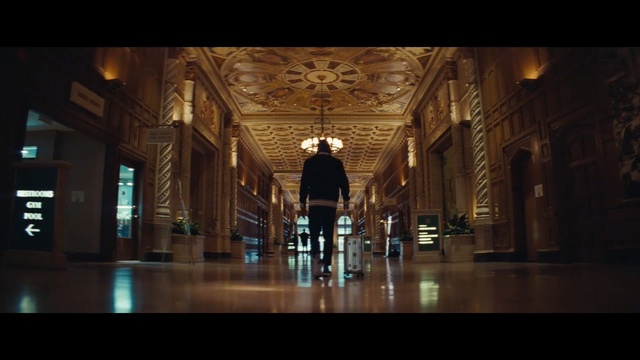 Video Reference: Darkness, Architecture, Building, Symmetry, Column, Photography, Place of worship, Arch, Basilica, Screenshot, Person, Indoor, Table, Clock, Standing, Large, Wooden, Glass, Room, Display, Man, Station, Text