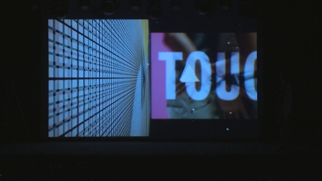 Video Reference: blue, display device, technology, electronic device, text, screen, electronic signage, light, gadget, darkness, Person