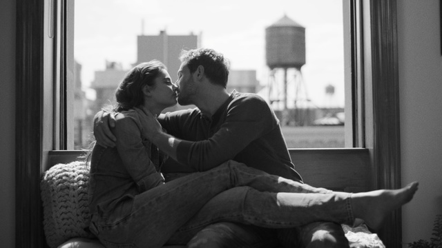 Video Reference: Photograph, Romance, Black-and-white, Monochrome, Sitting, Interaction, Snapshot, Photography, Love, Monochrome photography, Person, Window, Indoor, Looking, Woman, Man, Black, Young, Using, Living, Holding, White, Bench, Girl, Laptop, Computer, Phone, Room, Bus, Kiss, Black and white