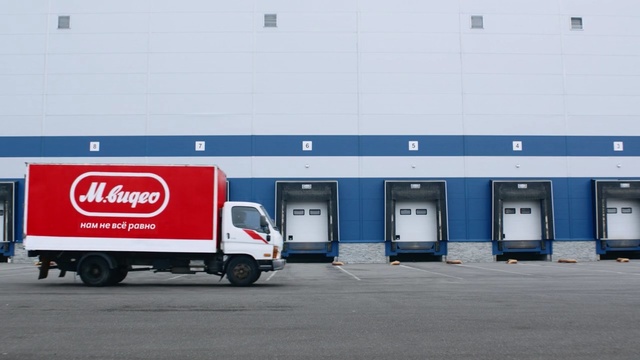 Video Reference: blue, motor vehicle, transport, vehicle, mode of transport, car, freight transport, cargo, truck, public utility, Person