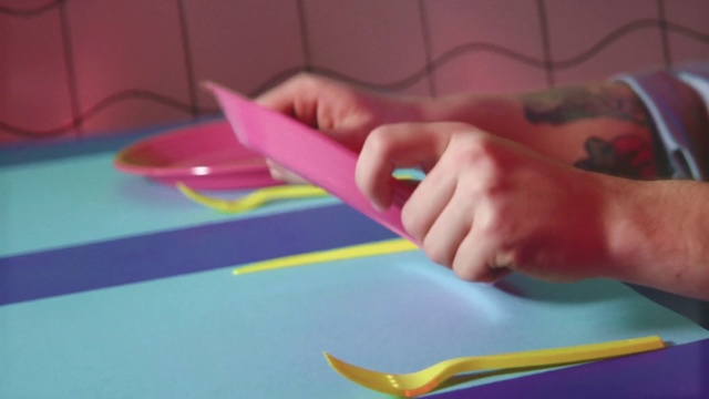 Video Reference: Construction paper, Paper, Play, Finger, Hand, Child, Paper product, Office supplies, Art paper, Toddler, Indoor, Person, Table, Small, Little, Toothbrush, Sitting, Food, Cutting, Cake, Using, Young, Boy, Holding, Laptop, Brush, Computer, Yellow, Plate, Keyboard, Birthday, Kitchen, Girl, Baby, Colorful, Teeth, Pink, Playing, White, Blue, Red, Pizza, Brushing, Laying, Child art