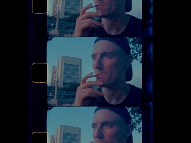 Video Reference: Face, Head, Selfie, Chin, Eyebrow, Forehead, Nose, Sky, Cool, Photography, Person, Man, Phone, Cellphone, Indoor, Mirror, Looking, Front, Holding, Monitor, Glasses, Photo, Teeth, Wearing, Screen, Brushing, Standing, Shirt, Dark, Male, Using, Talking, Video, Mouth, Woman, Food, Reflection, Red, Room, Human face, Screenshot, Text