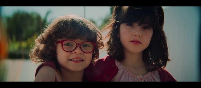 Video Reference: Face, Hair, Facial expression, People, Nose, Friendship, Child, Lip, Glasses, Head, Person, Looking, Young, Man, Standing, Photo, Holding, Front, Posing, Girl, Little, Boy, Sitting, Close, Wearing, Woman, White, Shirt, Group, Human face, Smile, Selfie, Eyes, Clothing, Portrait