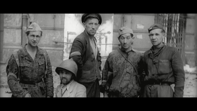 Video Reference: People, Photograph, Social group, Military, Soldier, Troop, Army, Military uniform, Movie, Military person, Person, Uniform, Standing, Photo, Group, Man, Window, Food, White, Black, Woman, Holding, Posing, Wearing, Train, Room, Shirt, Kitchen, Store, Human face, Clothing, Text, Black and white, Hat, Monochrome