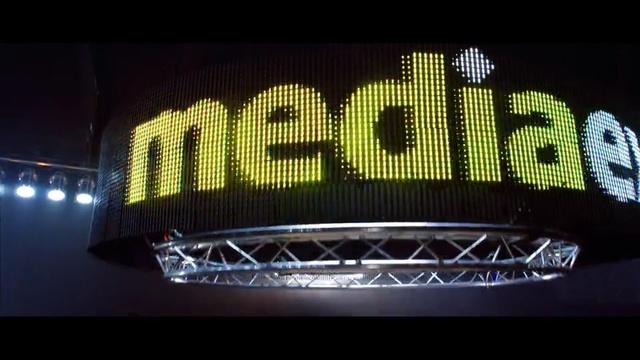 Video Reference: Font, Light, Yellow, Automotive lighting, Green, Lighting, Vehicle registration plate, Text, Signage, Automotive exterior, Person