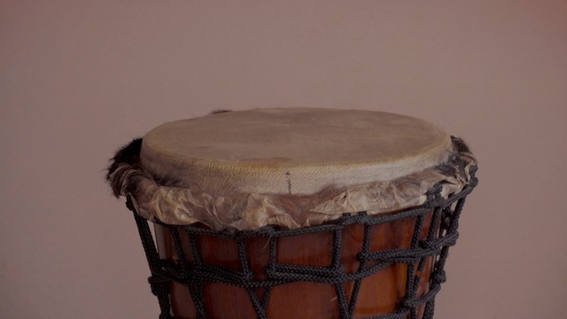 Video Reference: drum, musical instrument, drumhead, djembe, tom tom drum, skin head percussion instrument, hand drum, percussion, timbales, dholak