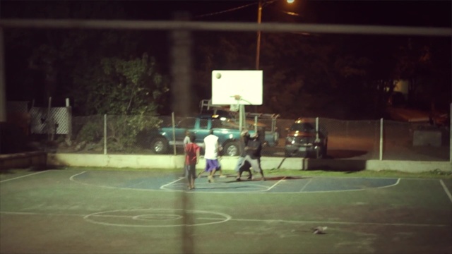 Video Reference: night, structure, recreation, sport venue, darkness, tree, sports, fun, basketball court, Person