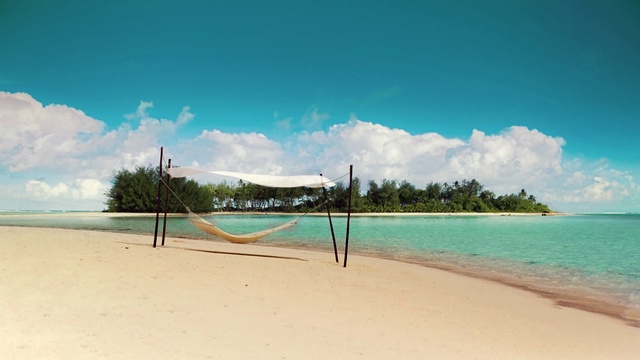 Video Reference: volleyball net, net, game equipment, beach, equipment, sea, sand, ocean, water, coast, sky, island, vacation, landscape, travel, shore, sport, tropical, holiday, summer, wave, coastline, tourism, paradise, clouds, Person