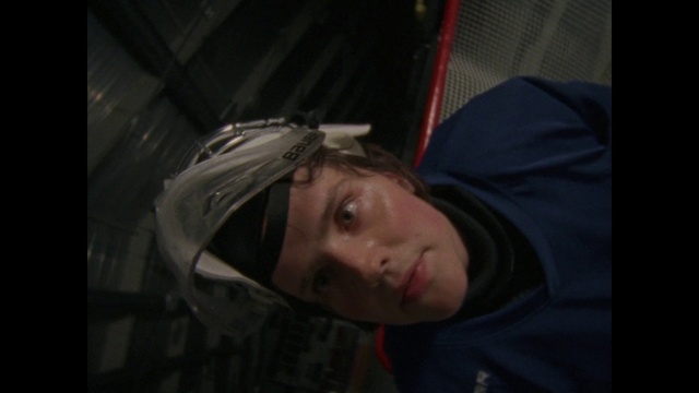 Video Reference: Face, Hair, Black, White, Nose, Cheek, Head, Lady, Darkness, Eyebrow, Person, Indoor, Man, Looking, Holding, Young, Sitting, Wearing, Front, Shirt, Woman, Girl, Boy, Mouth, Hat, Mirror, Standing, Laying, Red, Bed, Phone, Teeth, Room, Human face, Clothing, Helmet, Selfie