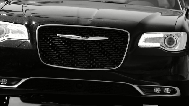 Video Reference: motor vehicle, grille, car, luxury vehicle, bumper, automotive design, automotive lighting, automotive exterior, vehicle, headlamp, Person