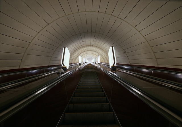 Video Reference: Escalator, Tunnel, Symmetry, Light, Architecture, Transport, Line, Infrastructure, Metropolitan area, Fixed link