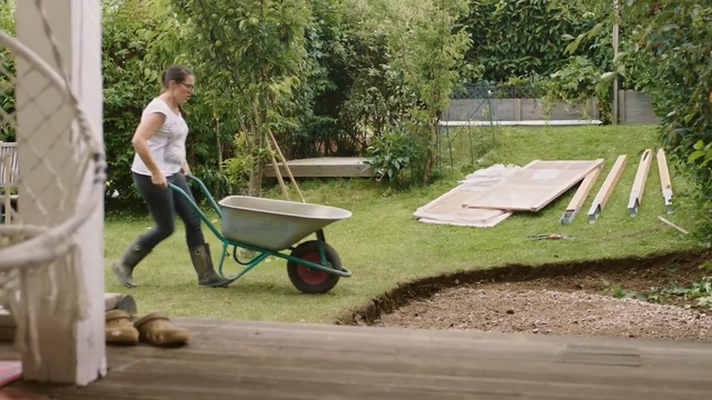 Video Reference: Wheelbarrow, Cart, Grass, Yard, Vehicle, Backyard, Leisure, Table, Soil, Tree