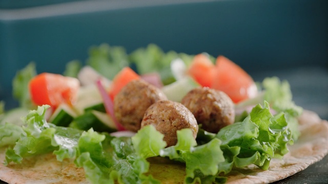 Video Reference: Dish, Food, Cuisine, Ingredient, Meatball, Salad, Falafel, Vegetarian food, Produce, Recipe, Person