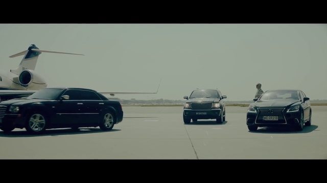 Video Reference: Land vehicle, Vehicle, Car, Automotive design, Luxury vehicle, Audi, Sports sedan, Executive car, Performance car, Person, Outdoor, Road, Small, White, Street, Plane, Man, Airplane, Air, Light, Truck, Traffic, Driving, Parked, Highway, Runway, Flying, Water, Dog, Group, Jet, Riding, Wheel, Text, Tire, Personal luxury car, Auto part, Way, Sedan