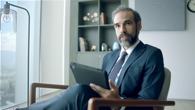 Video Reference: technology, white collar worker, electronic device, businessperson, suit, communication, furniture, facial hair, business, Person