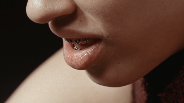 Video Reference: lip, chin, nose, tongue, close up, cheek, mouth, neck, jaw, ear