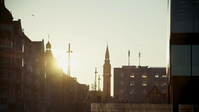 Video Reference: Urban area, Atmospheric phenomenon, Sky, City, Morning, Spire, Metropolitan area, Human settlement, Town, Architecture
