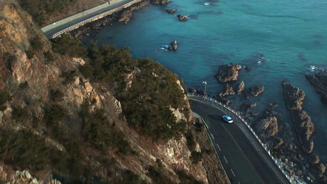 Video Reference: Coast, Aerial photography, Water, Coastal and oceanic landforms, Cliff, Cape, Sea, Infrastructure, Promontory, Bay
