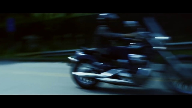Video Reference: Motorcycle, Black, Vehicle, Light, Automotive design, Mode of transport, Automotive lighting, Darkness, Scooter, Wheel