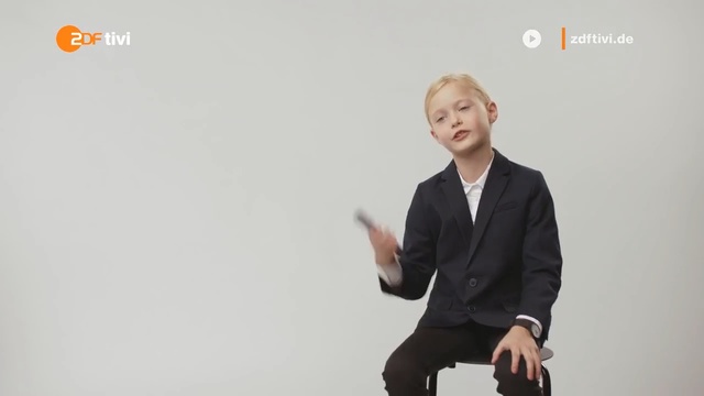 Video Reference: Suit, Standing, Sitting, Formal wear, Businessperson, Presentation, Public speaking, Font, Gentleman, Gesture, Person