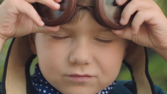 Video Reference: Face, Hair, Eyebrow, Forehead, Nose, Cheek, Eyewear, Skin, Child, Head, Person