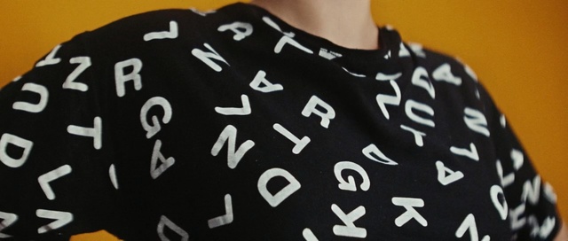 Video Reference: black, t shirt, outerwear, pattern, font, product, design, sleeve, brand