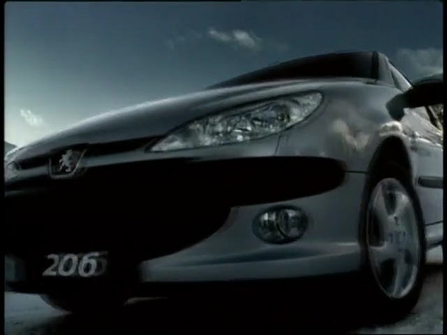 Video Reference: land vehicle, car, vehicle, mid size car, vehicle registration plate, family car, mode of transport, bumper, automotive design, light, Person