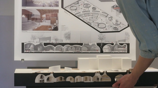 Video Reference: Wall, Room, Design, Automotive design, Interior design, Architecture, Furniture, Table, Drawing, Person