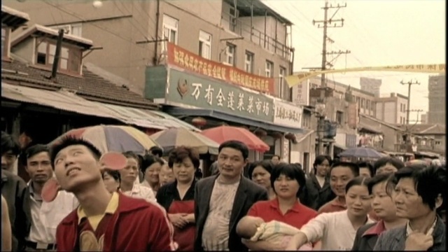 Video Reference: crowd, city, street, pedestrian, vehicle, event, tourism, Person